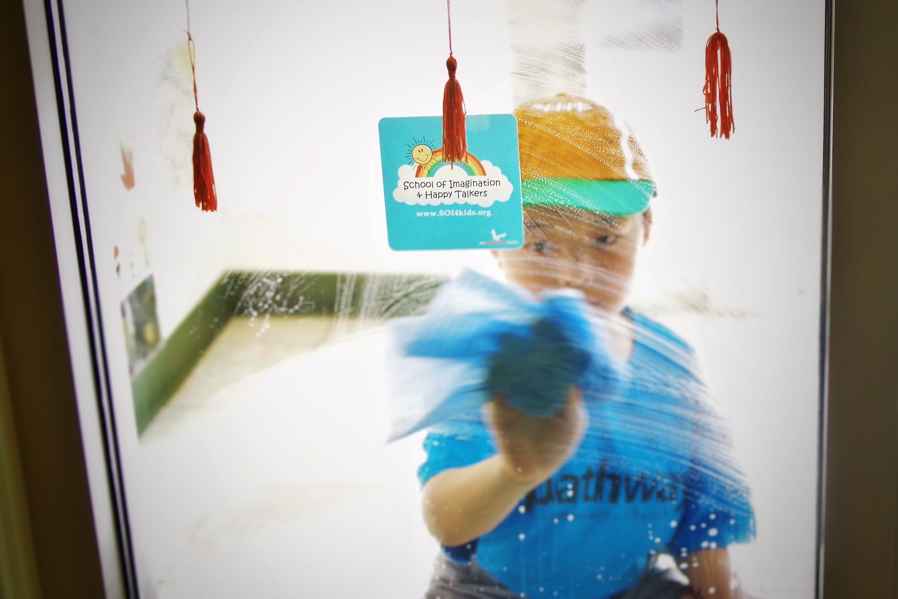 DP, school of imagination, window cleaning 1 boy w. school of imagination logo