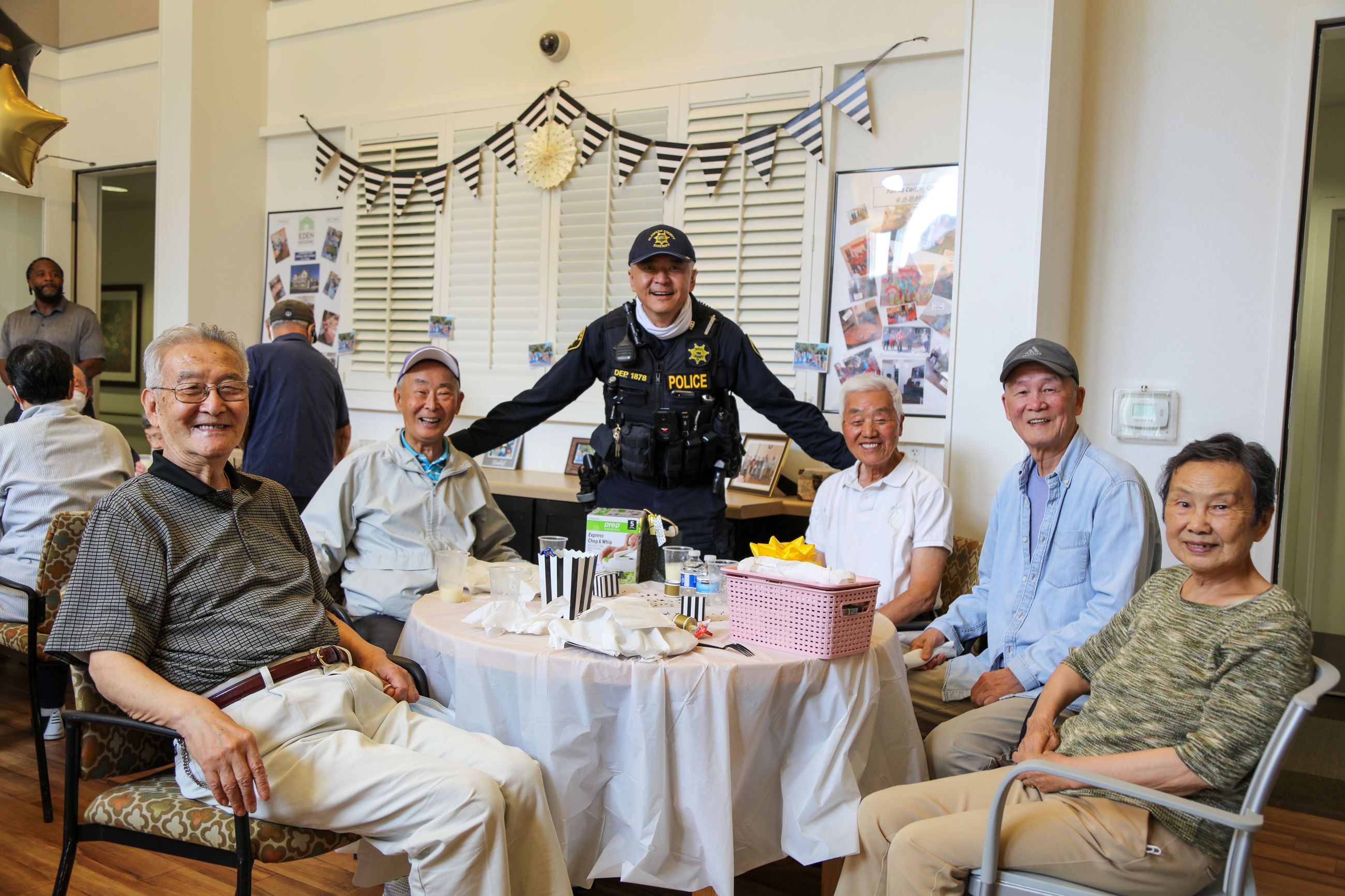 Dublin Police with elderly folks around a table.